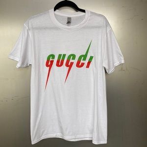 Men’s knock off Gucci T shirt. Size M. White. 100% cotton. Never worn.